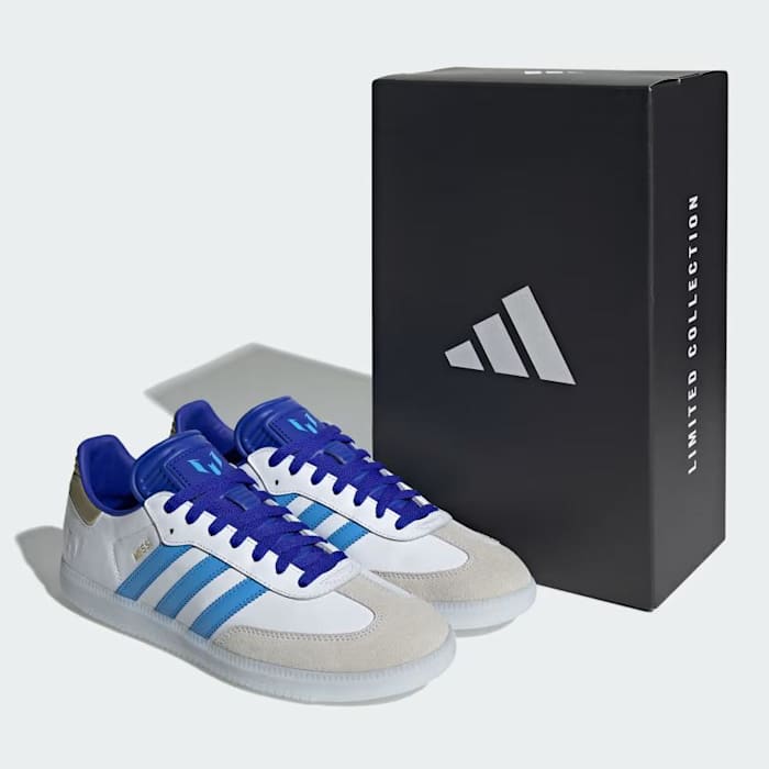 Side view of Lionel Messi's white and blue adidas Sambas.
